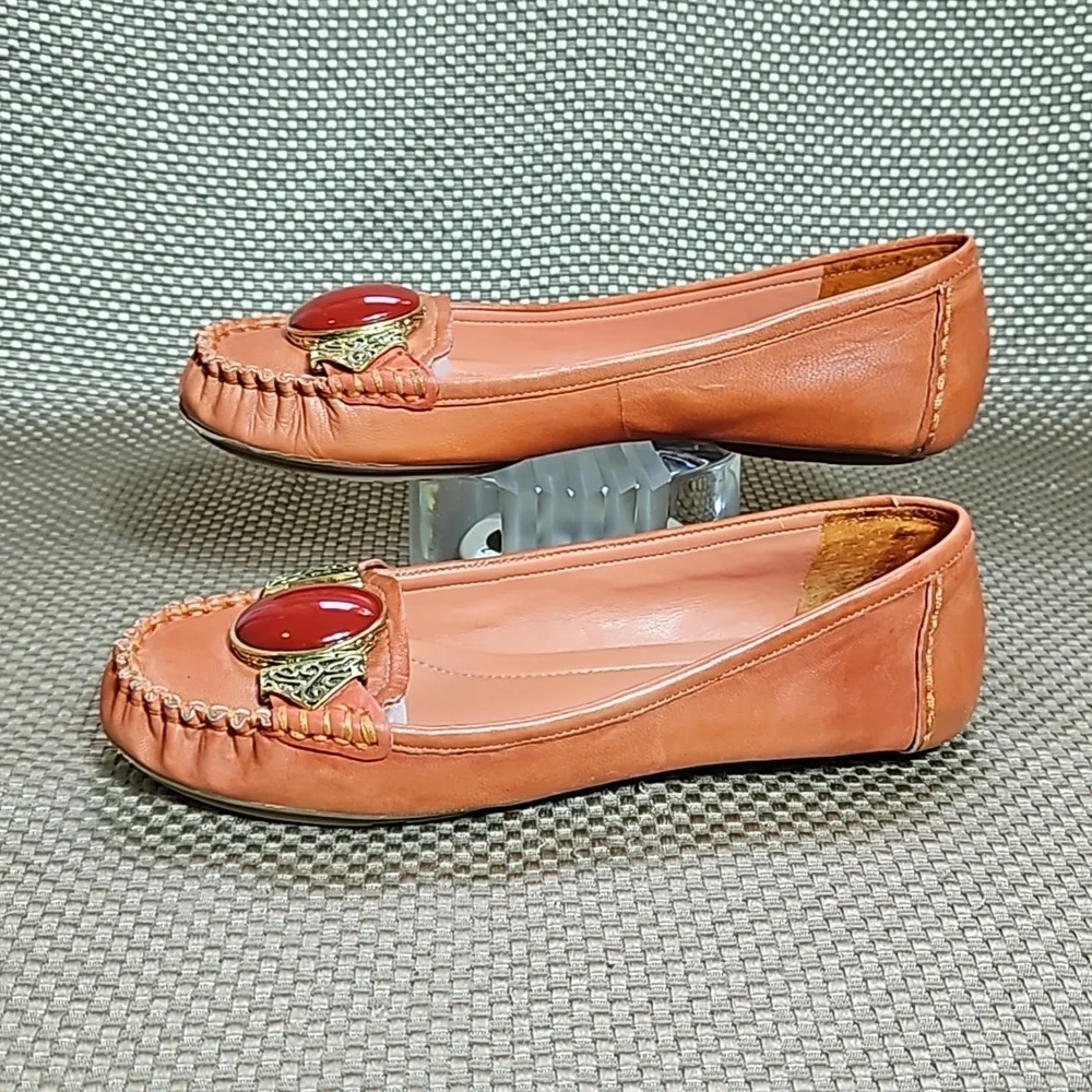 BCBG Leather Loafers.  Gold Embellishment with Coral Colored Jewel.  Size 6.5 B